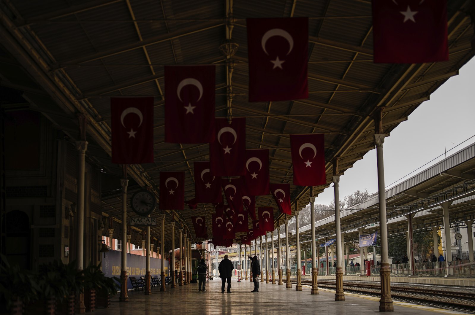 People walk along Sirkeci railway station, Istanbul, Türkiye, March 20, 2024. (AP Photo)
