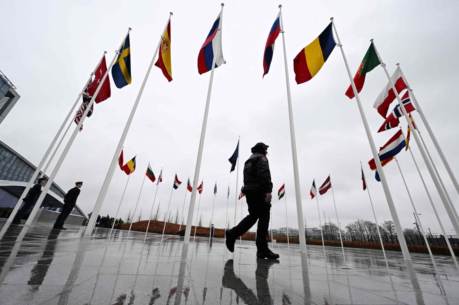 Flags of NATO member countries flutter on poles outside the bloc&#039;s headquarters, Brussels, Belgium, March 11, 2024. (AFP Photo)