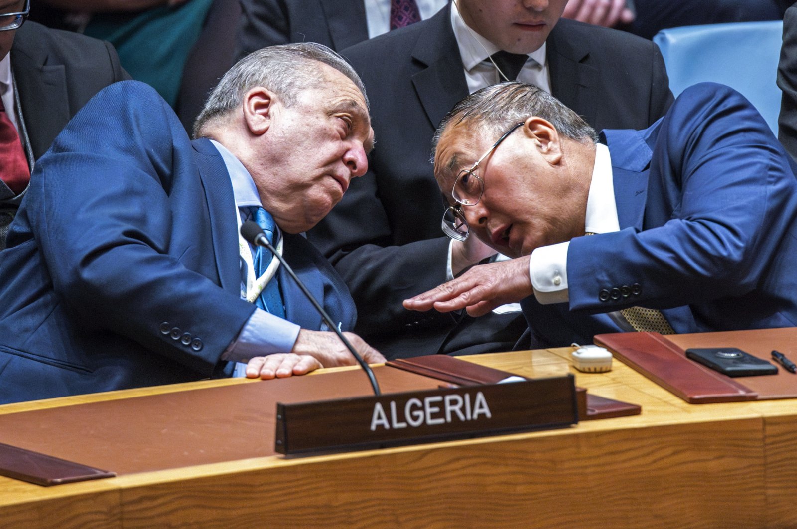 Permanent Representative of Algeria to the United Nations Amar Bendjama (L) talks to China&#039;s ambassador to the U.N., Zhang Jun, after voting against a U.S. ceasefire resolution for the Gaza war during a U.N. Security Council meeting at the U.N. headquarters, in New York City, U.S., March 22, 2024. (AFP Photo)