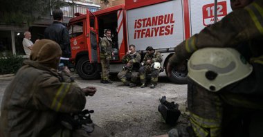 Firefighters rest during their intervention at the site of a fire in a residential building in Istanbul, Türkiye, April 2, 2024. (AFP Photo)