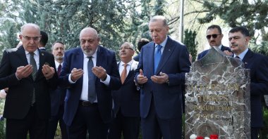 President Recep Tayyip Erdoğan (2nd R) and Alparslan Türkeş's son Yıldırım Tuğrul Türkeş pray by the grave of Alparslan Türkeş, Ankara, Türkiye, April 4, 2024. (AA Photo)