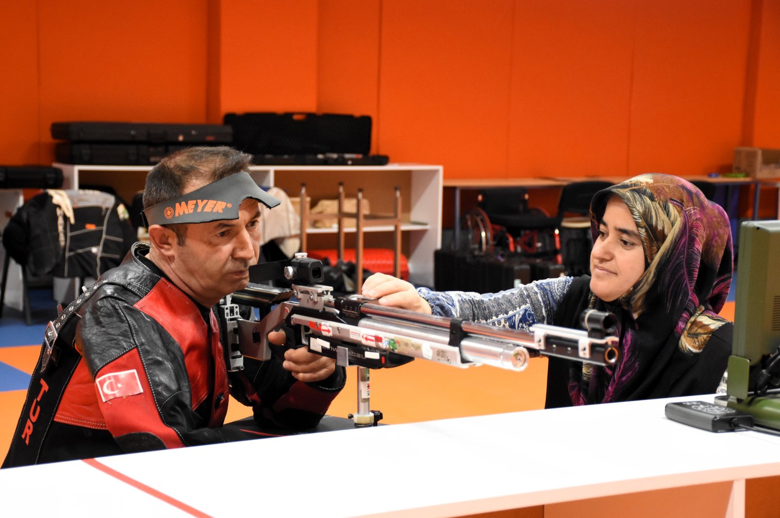 Turkish shooter Tayyar Sinankılı (L) trains with his wife Emine Sinankılı at the Aksaray Paralympic Games Preparation Center, Aksaray, Türkiye, April 4, 2024. (AA Photo)