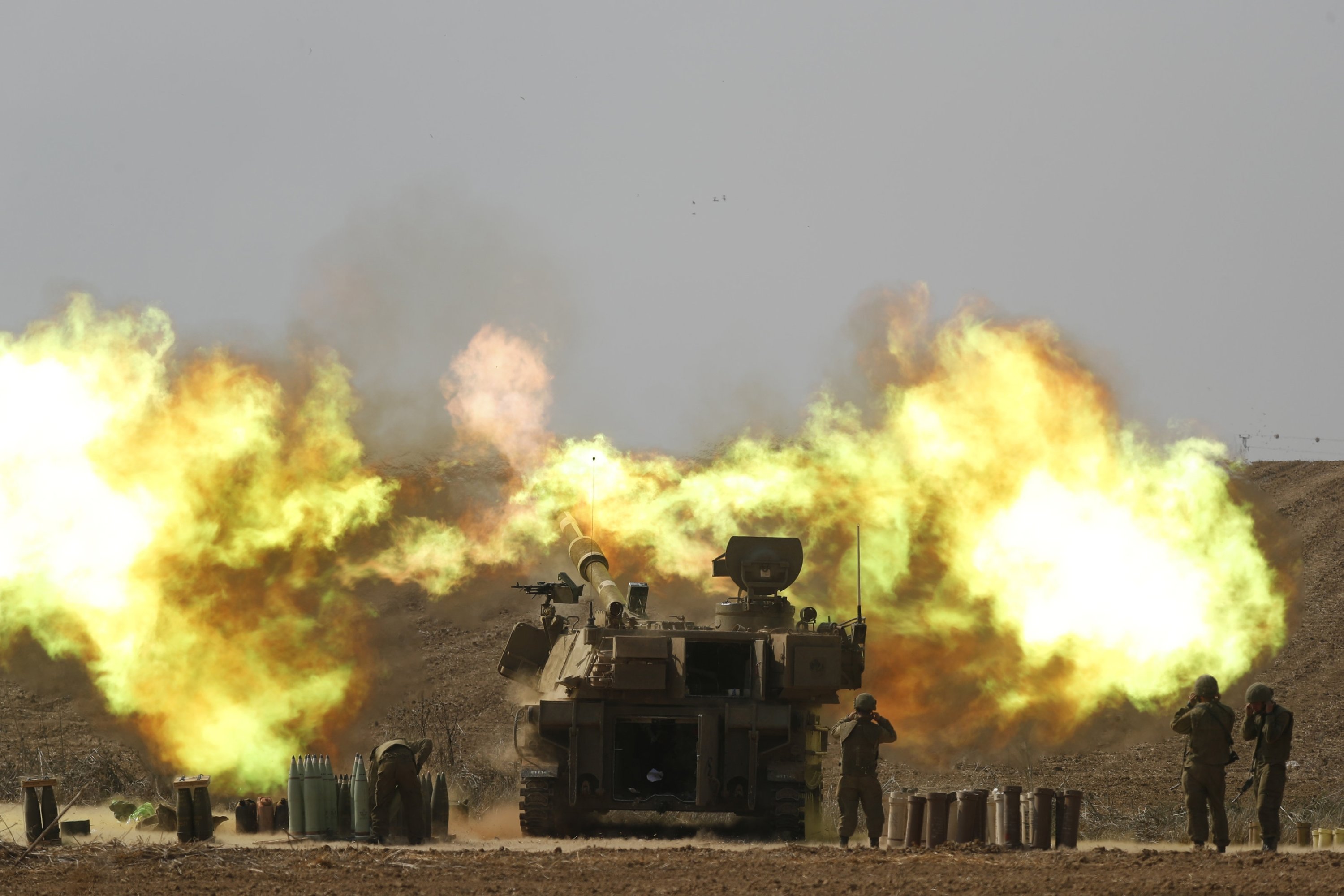 An Israeli artillery unit fires toward Gaza along the border, southern Israel, Oct. 11, 2023. (EPA Photo)