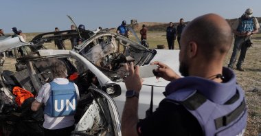 U.N. staff members inspect the remains of a car used by U.S.-based aid group World Central Kitchen that was hit by an Israeli strike the previous day, Deir al-Balah, Gaza Strip, Palestine, April 2, 2024. (AFP Photo)