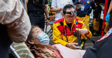 A woman receives medical attention after being rescued from Taroko National Park, following a magnitude 7.4 earthquake, Hualien, Taiwan, April 4, 2024. (EPA Photo)