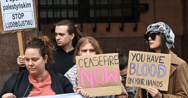Demonstrators hold placards during a protest outside the Ministry of Foreign Affairs, Warsaw, Poland, April 5, 2024. (EPA Photo)