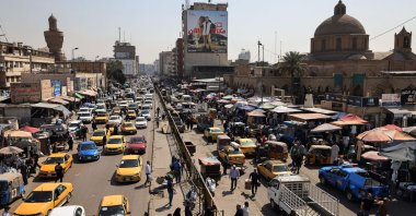 Consumers and vehicles gather at Shorja market in central Baghdad, Iraq, March 7, 2024. (AFP Photo)