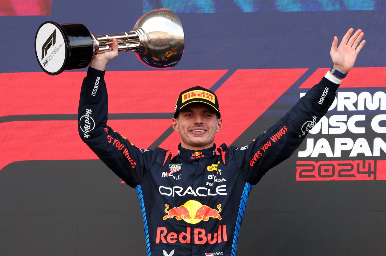 Red Bull&#039;s Max Verstappen celebrates with a trophy on the podium after winning the Japanese Grand Prix, Suzuka, Japan, April 7, 2024. (Reuters Photo)