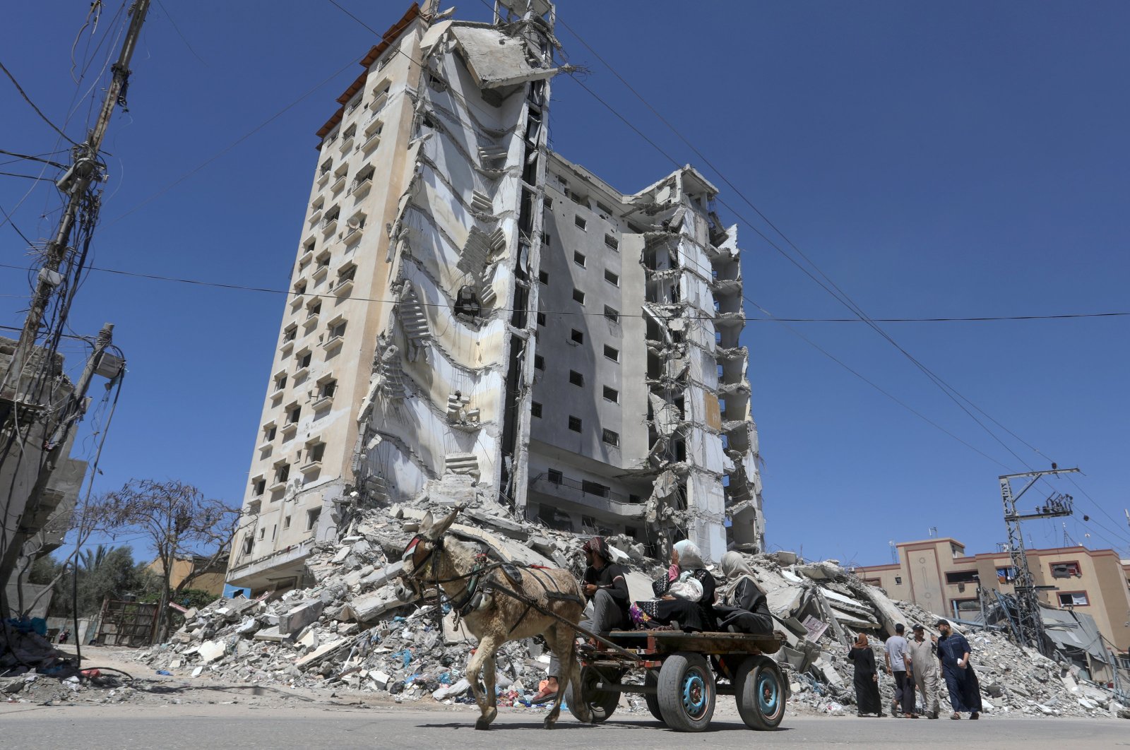 Internally displaced Palestinians use a donkey cart to move away from an area devastated by Israeli attacks, Rafah, southern Gaza, Palestine, April 6, 2024.