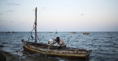 A fishermen empties his boat from water, Maputo, Mozambique, Sept. 1, 2019. (Reuters Photo)