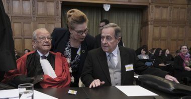 Nicaragua's Ambassador Carlos Jose Arguello Gomez (R) and Alain Pellet (L), a lawyer representing Nicaragua, wait for the start of a two-day hearing at the World Court, The Hague, Netherlands, April 8, 2024. (AP Photo)