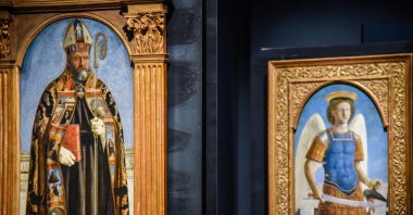 The paintings &quot;Sant’Agostino&quot; (L) and &quot;San Michele Arcangelo&quot; (R), two panels of the Augustinian Polyptych created by Piero Della Francesca, are on display during the exhibition &quot;Piero della Francesca and the reunited Augustinian Polyptych&quot; at the Poldi Pezzoli Museum in Milan, Italy, March 19, 2024. (EPA Photo)