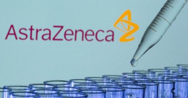 Test tubes are seen in front of a displayed AstraZeneca logo in this illustration taken, May 21, 2021. (Reuters File Photo)