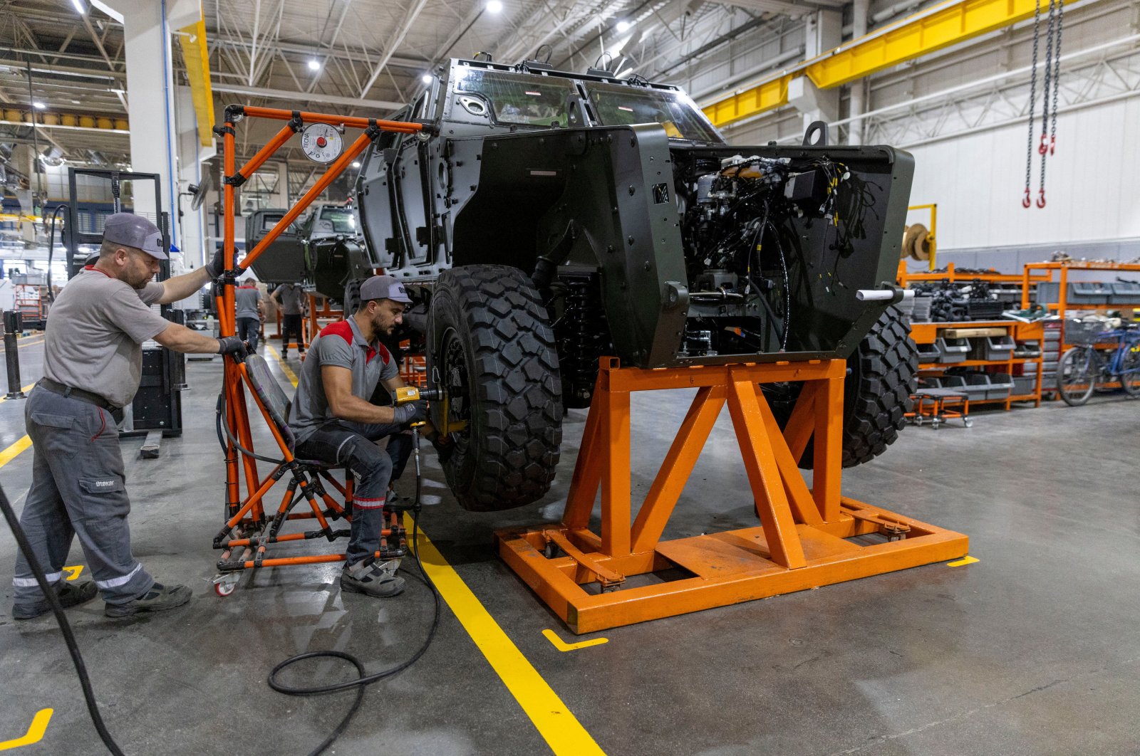 Technicians work on a Cobra II, an armored personnel carrier, at a production line at the heavy commercial and armored vehicle manufacturer Otokar factory in Arifiye, Sakarya province, northwestern Türkiye, July 13, 2023. (Reuters Photo)