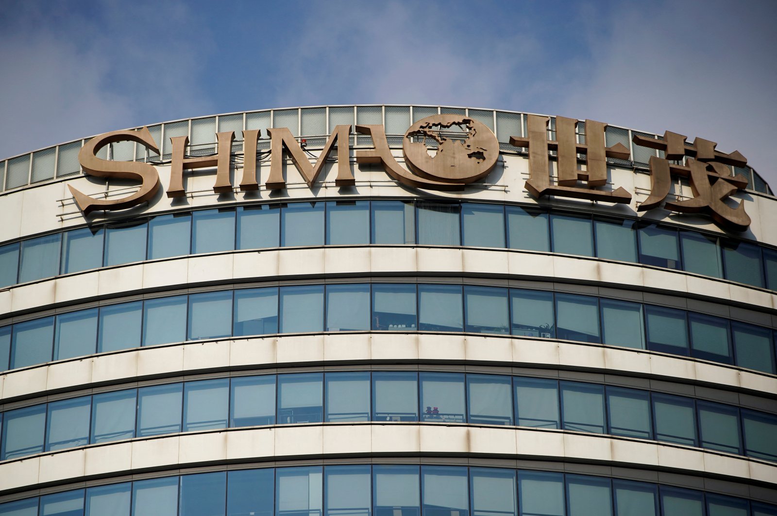 The logo of property developer Shimao Group is seen on the facade of Shimao Tower in Shanghai, China, Jan. 13, 2022. (Reuters Photo)