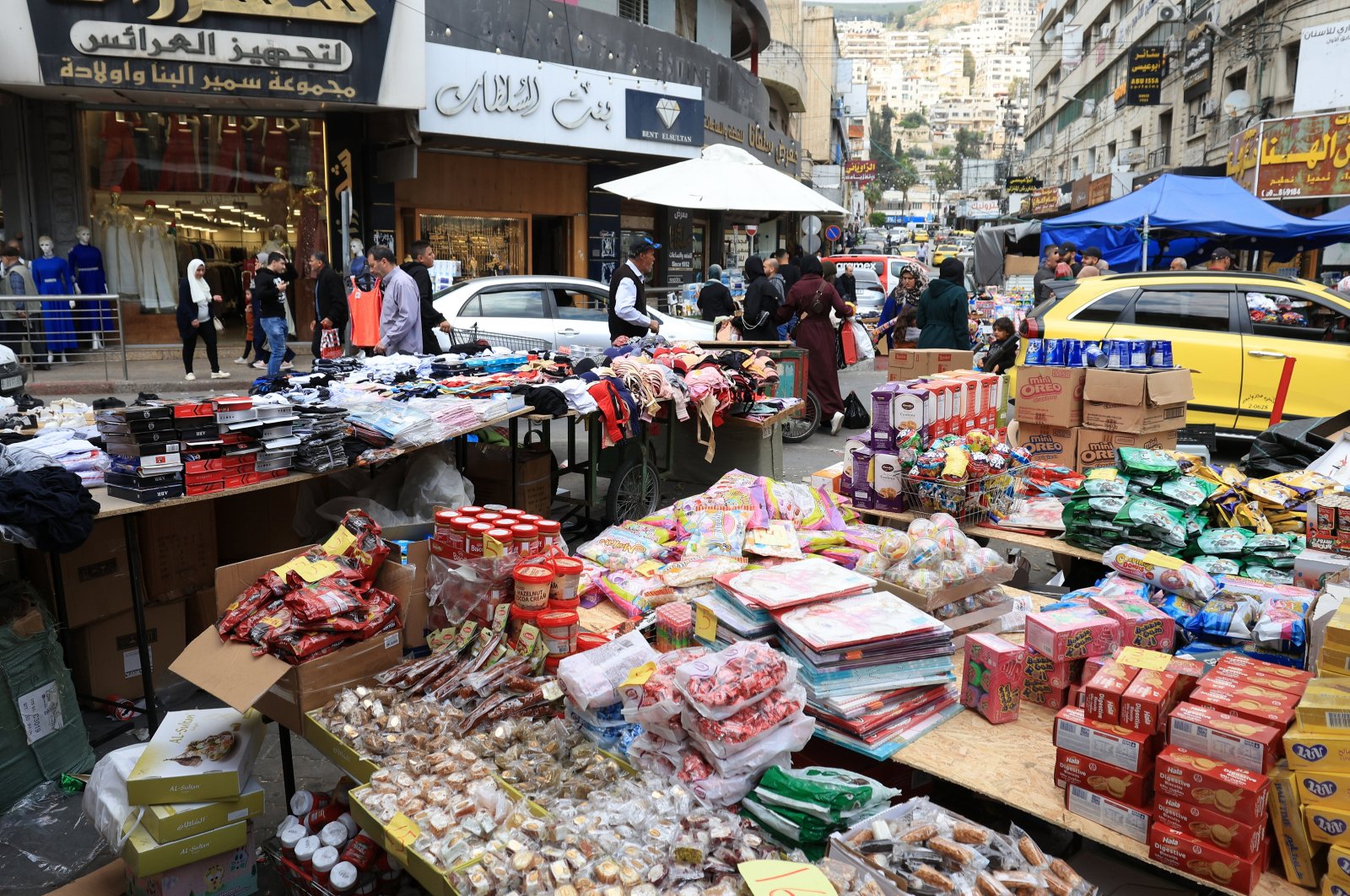 Palestinians visit a market ahead of the Eid al-Fitr holiday in the occupied West Bank city of Nablus, Palestine, April 8, 2024. (EPA Photo)