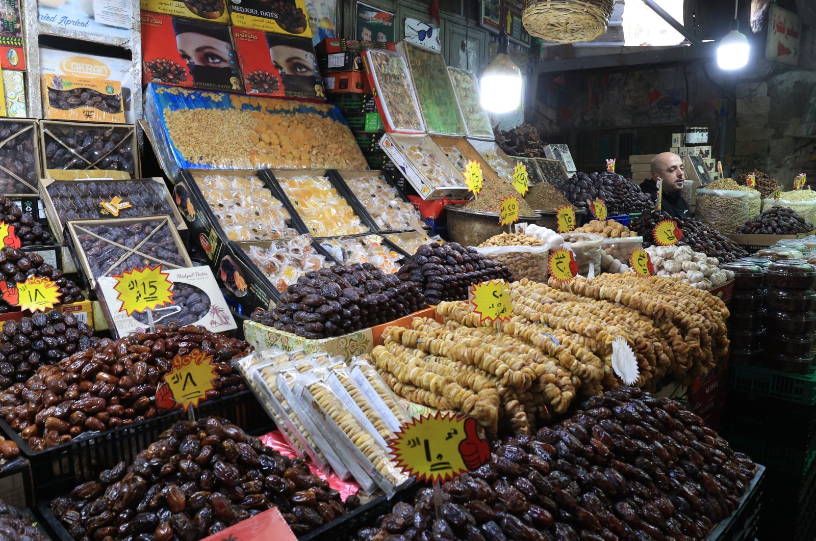 A Palestinian vendor sells dates at a street stall on the second Friday of the Muslims&#039; holy month of Ramadan in the old West Bank city of Nablus, Palestine, March 22, 2024. (EPA Photo)