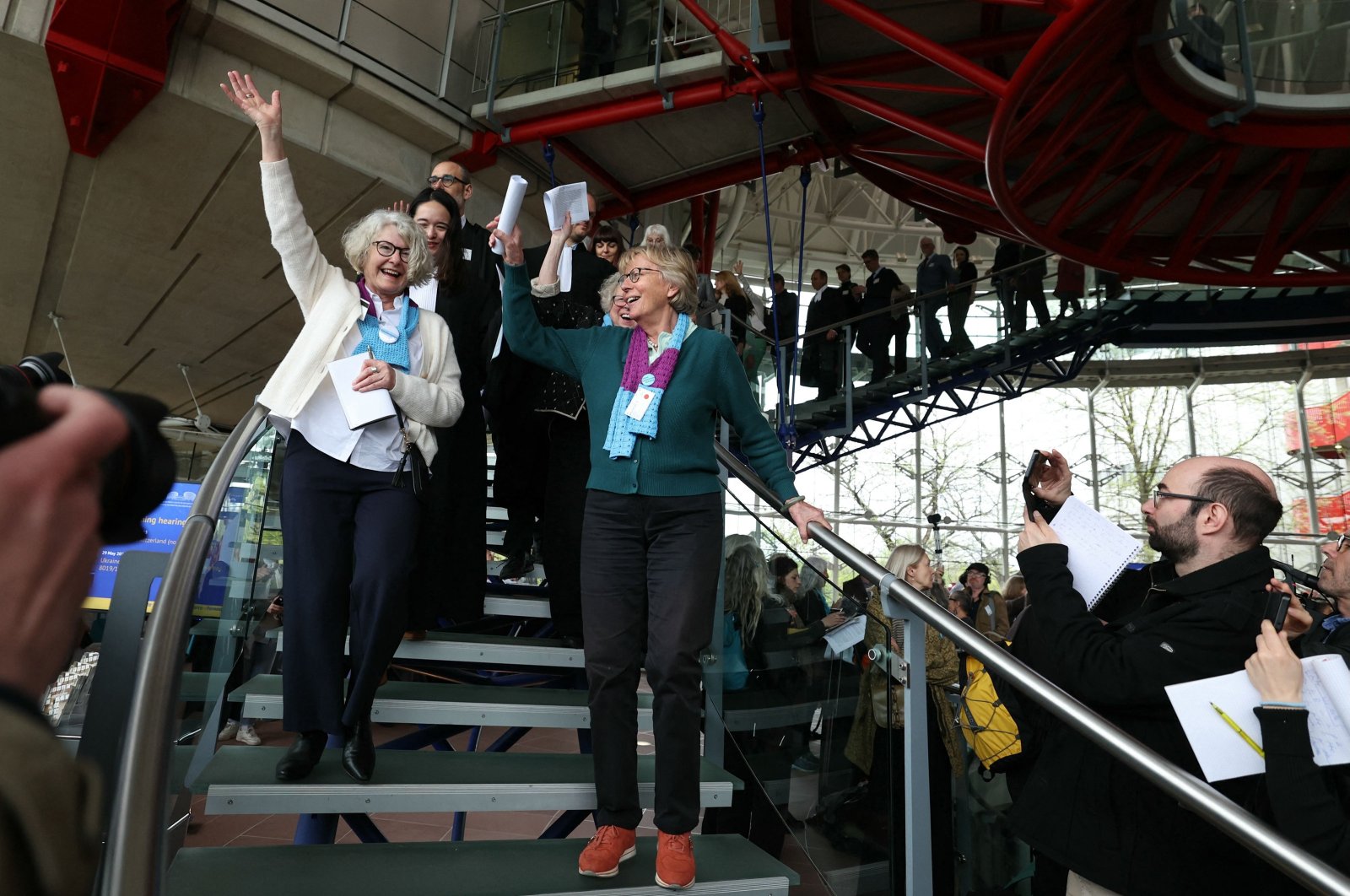 Members of the Senior Women for Climate Protection association react after the announcement of decisions after a hearing of the European Court of Human Rights (ECHR) to decide in three separate cases if states are doing enough in the face of global warming in rulings that could force them to do more, in Strasbourg, eastern France, April 9, 2024. (AFP Photo)