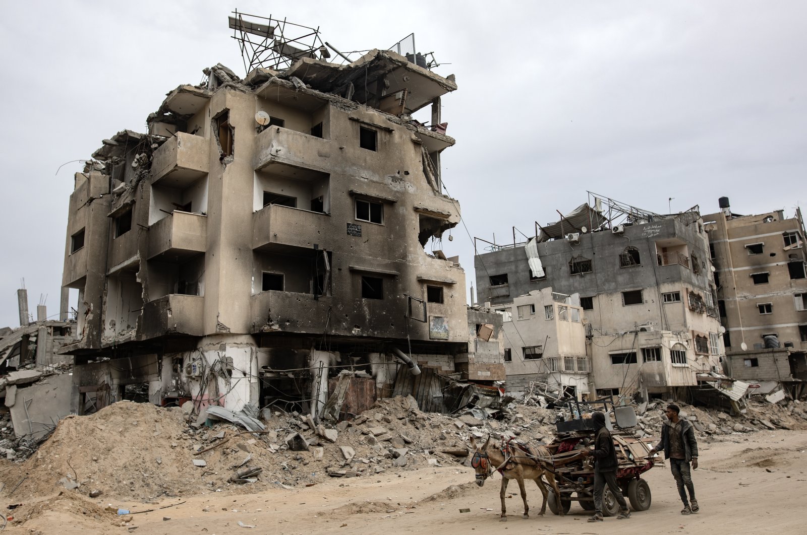 Palestinians drive a cart past destroyed buildings in Khan Younis after Israel pulled its ground forces out, Gaza Strip, Palestine, April 8, 2024. (EPA Photo)