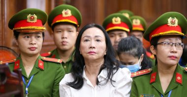 Truong My Lan (C), chairperson of Van Thinh Phat Holdings, sits during her trial at the Ho Chi Minh City People's Court in Ho Chi Minh City, Vietnam, April 11, 2024. (EPA Photo)