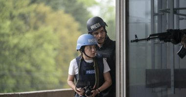 This image released by A24 shows Cailee Spaeny (L) and Wagner Moura in a scene from &quot;Civil War.&quot; (AP Photo)