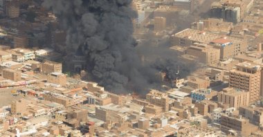 A screen grab shows black smoke and fire at Omdurman market, Omdurman, Sudan, May 15, 2023. (Reuters Photo)