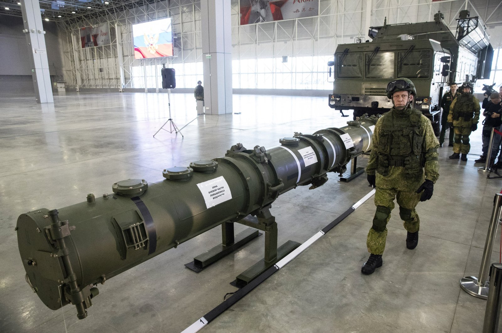 A Russian military officer walks past the 9M729 land-based cruise missile on display with its launcher, right, in Kubinka outside Moscow, Russia, Wednesday, Jan. 23, 2019. (AP File Photo)