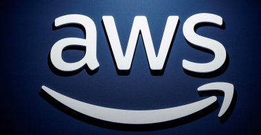 A logo for Amazon Web Services (AWS) is seen during the KubeCon   CloudNativeCon Europe hosted by the Cloud Native Computing Foundation (CNCF) in Paris, France, March 20, 2024. (Reuters Photo)