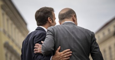 German Chancellor Olaf Scholz (R) welcomes French President Emmanuel Macron for a joint dinner in a restaurant in Potsdam near Berlin, Germany, June 6, 2023. (AP Photo)