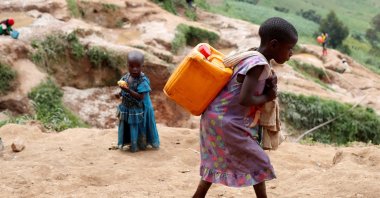 A girl carries a container of water at a coltan mine, Kamatare, Masisi territory, North Kivu Province, Democratic Republic of Congo, Dec. 1, 2018. (Reuters Photo)