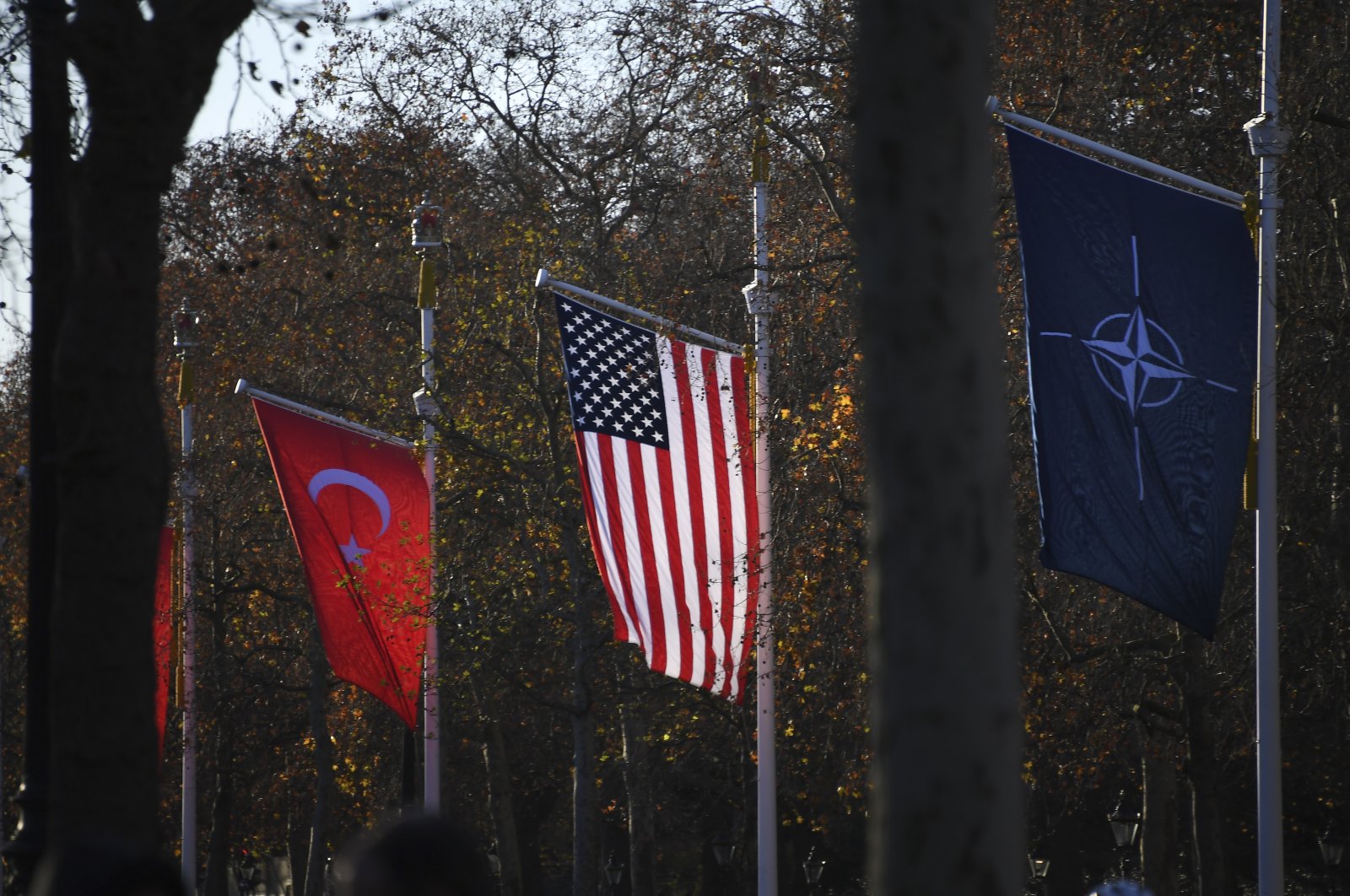 The flags of NATO, the United States and Türkiye line The Mall, London, U.K., Dec. 3, 2019. (AP Photo)