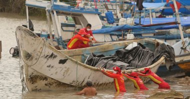 Authorities work on a boat found drifting with several decomposing corpses onboard, in the state of Para, in the Brazilian Amazon, Braganca, Brazil, April 15, 2024. (EPA Photo)