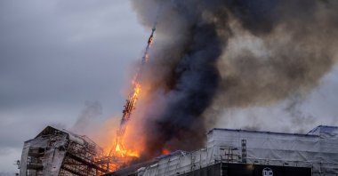 The tower collapsed after the Old Stock Exchange, Boersen, caught fire in Copenhagen, Denmark, April 16, 2024. (Reuters Photo)