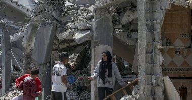 Palestinian families inspect their destroyed houses in the al-Maghazi refugee camp, Gaza Strip, Palestine, April 15, 2024. (EPA Photo)