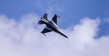 A Danish F-16 aircraft showcases some of its capabilities at a press event at Skrydstrup Air Base in Denmark, where Denmark's minister of defense met his Argentinian counterpart. The occasion is the signing ceremony of the contract for the sale of 24 Danish F-16 combat aircraft to Argentina on April 16, 2024. (AFP Phoıto)