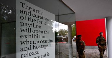  Italian soldiers stand guard in front of  Israel's pavilion during the pre-opening of the Venice Biennale art show, April 16, 2024. (AFP Photo)