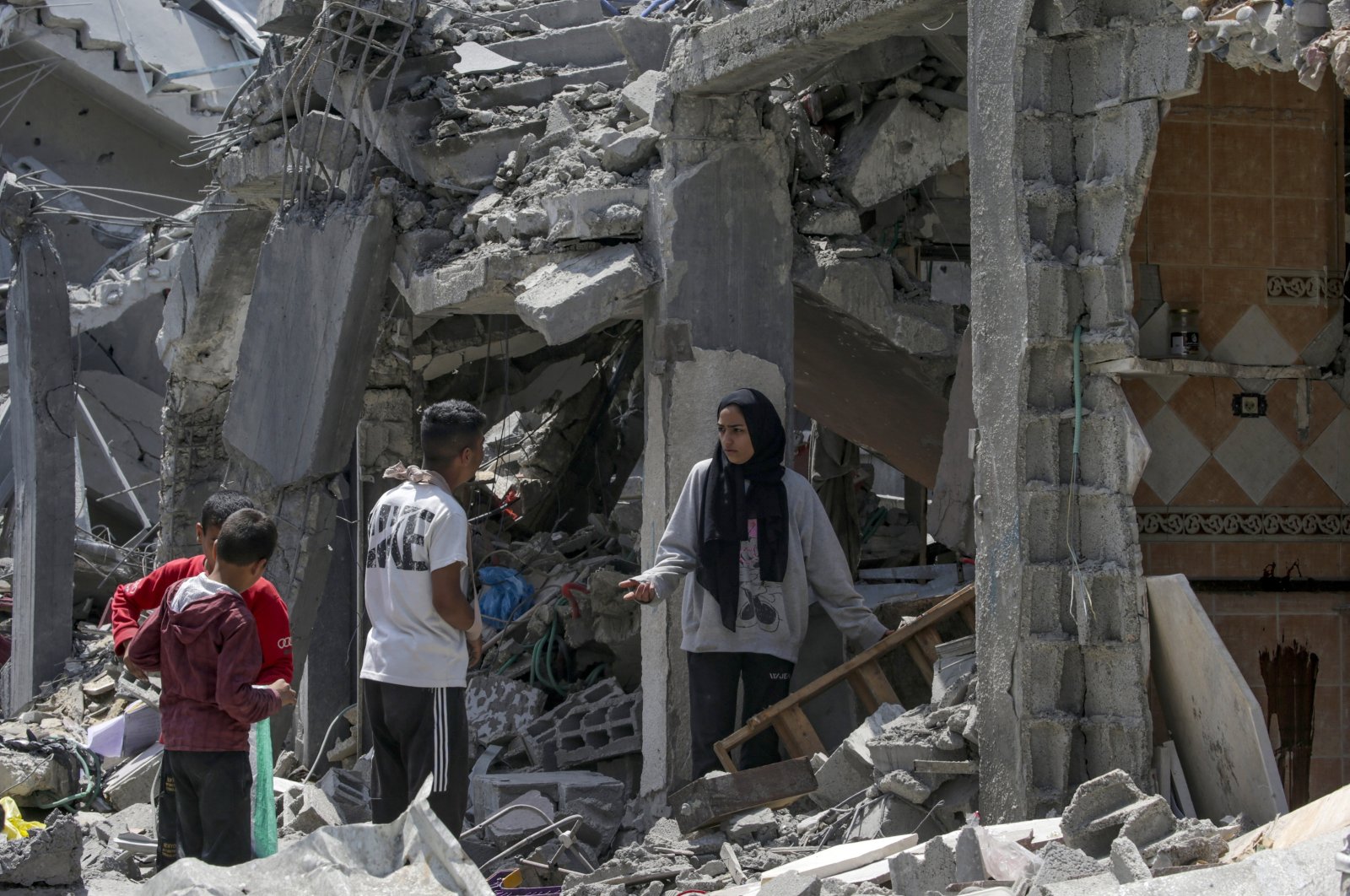 Palestinian families inspect their destroyed houses in the al-Maghazi refugee camp, Gaza Strip, Palestine, April 15, 2024. (EPA Photo)
