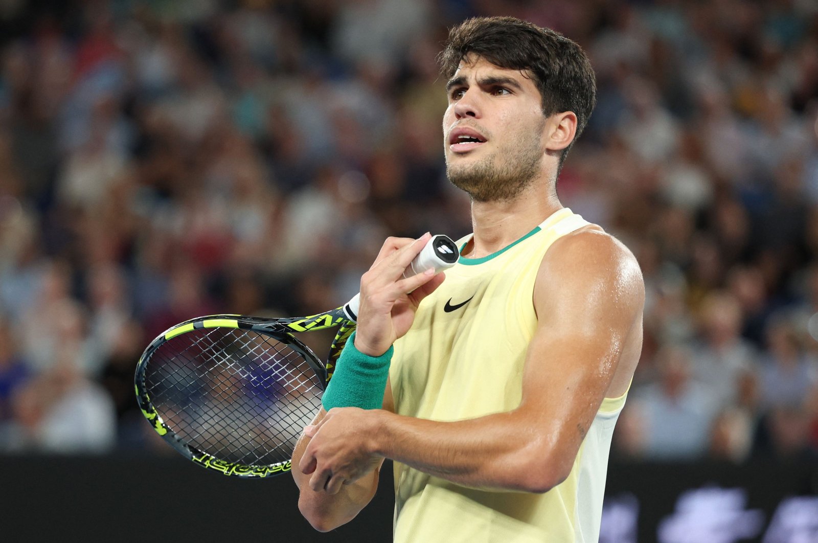 Spain&#039;s Carlos Alcaraz reacts after a point against Germany&#039;s Alexander Zverev during their men&#039;s singles quarterfinal match on Day 11 of the Australian Open, Melbourne, Australia, Jan. 24, 2024. (AFP Photo)