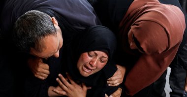 A woman reacts next to the bodies of Palestinians killed in Israeli strikes, amid the ongoing Israeli bombardments, Rafah, Gaza Strip, Palestine, April 16, 2024. (Reuters Photo)