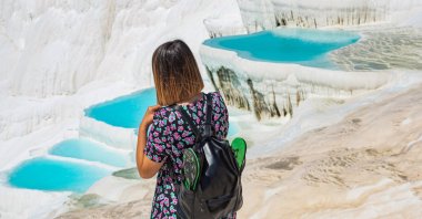 A tourist visits Pamukkale, a World Heritage-protected site in western Türkiye, April 25, 2022. (Reuters Photo)