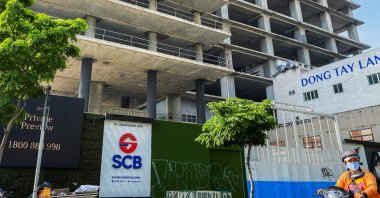 A logo of Saigon Joint Stock Commercial Bank (SCB) is seen in front of an under-construction building in Ho Chi Minh City, Vietnam, Nov. 30, 2023. (Reuters Photo)