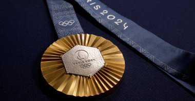 A Paris 2024 Olympic Games gold medal is seen on display at Chaumet jewellery, Paris, France, Feb. 1, 2024. (Reuters Photo)
