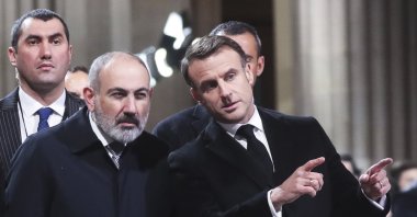 French President Emmanuel Macron (R) speaks with Armenian Prime Minister Nikol Pashinyan during an event in Paris, France, Feb. 21, 2024. (AP Photo)