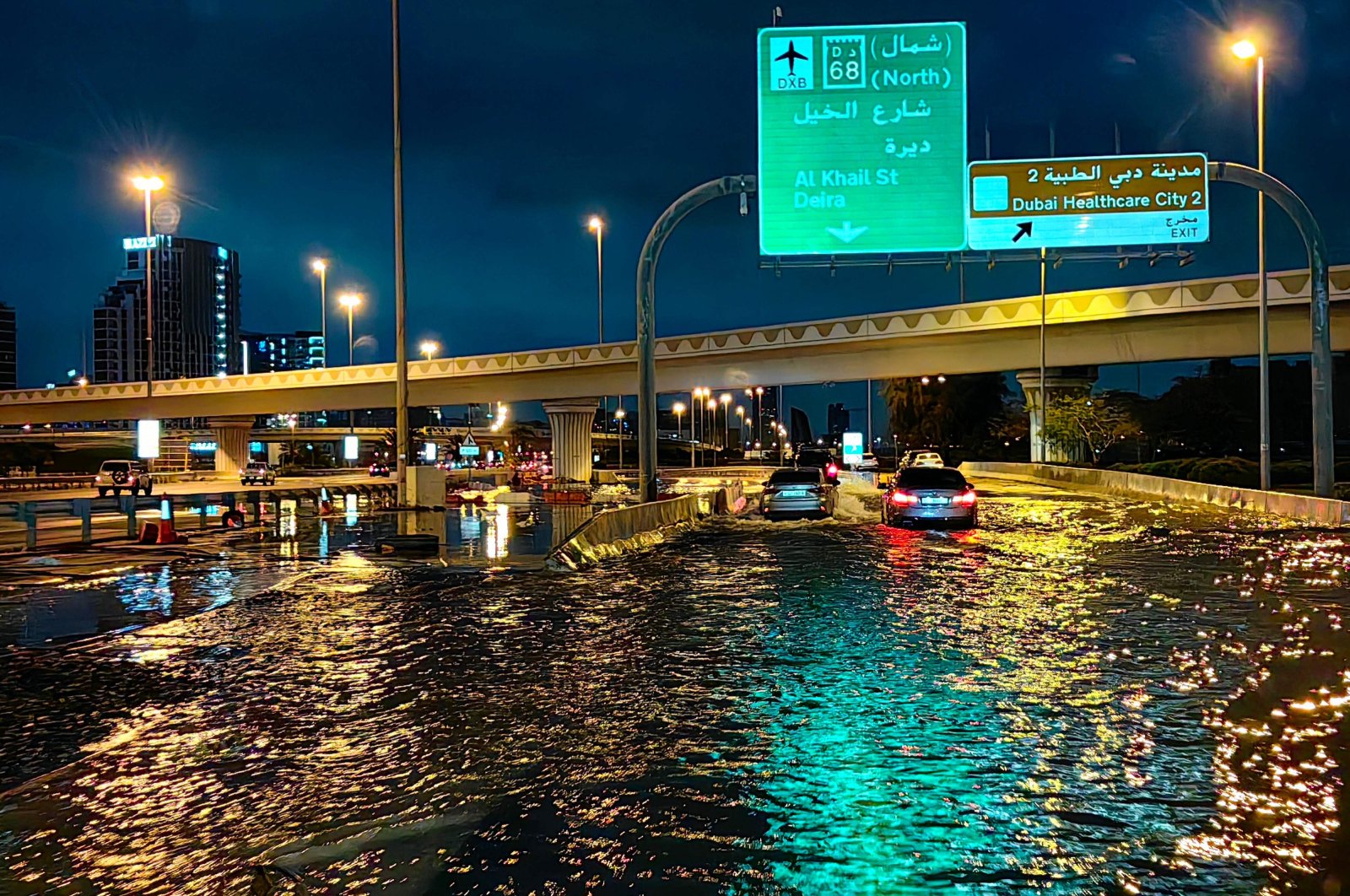 Motorists drive along a flooded street following heavy rains, Dubai, UAE, April 17, 2024. (AFP Photo)