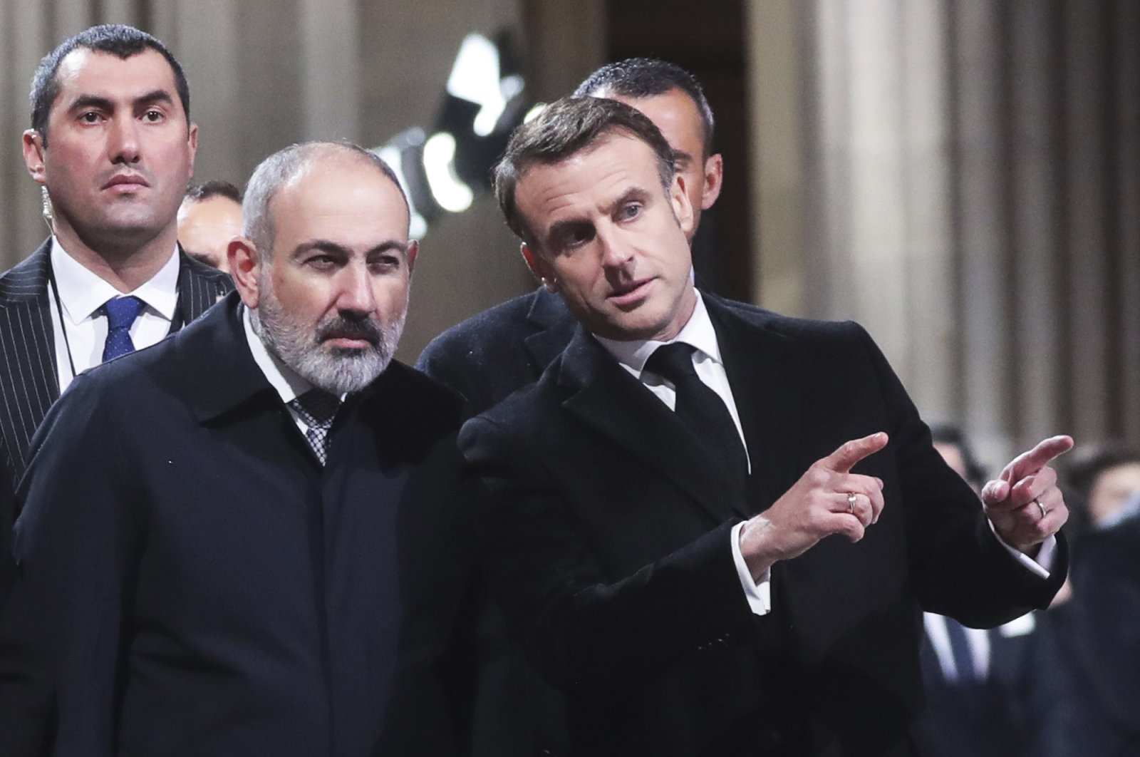 French President Emmanuel Macron (R) speaks with Armenian Prime Minister Nikol Pashinyan during an event in Paris, France, Feb. 21, 2024. (AP Photo)