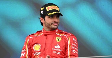 Ferrari&#039;s Spanish driver Carlos Sainz stands on the podium after finishing third in the Formula One Japanese Grand Prix race at the Suzuka circuit, Suzuka, Japan, April 7, 2024. (AFP Photo)