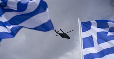 Two military helicopters fly over during a military parade marking Independence Day, Athens, Greece, March 25, 2024. (Reuters Photo)