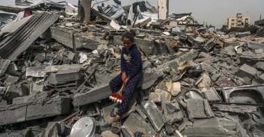 A Palestinian girl sits among the rubble of a house after returning to Al Nusairat refugee camp following the Israeli army's retreat from the area, Gaza Strip, Palestine, April 18, 2024. (EPA Photo)