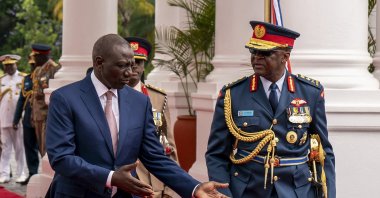 Chief of Kenya Defense Forces Gen. Francis Ogolla (R) speaks to Kenyan President William Ruto (L) and Kenyan first lady Rachel Ruto (unseen) as they prepare to receive Britain's King Charles III and Queen Camilla (unseen) during a ceremonial welcome, State House, Nairobi, Kenya, Oct. 31, 2023. (AFP Photo)