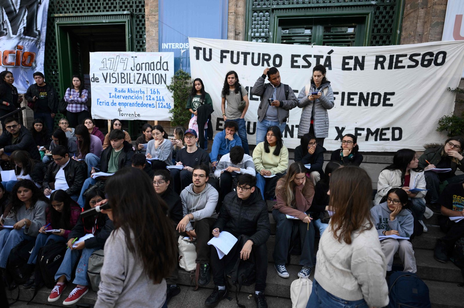 Medical students of the University of Buenos Aires (UBA) protest at the entrance of the university against the recent economic measures introduced by the government of President Javier Milei, Buenos Aires, Argentina, April 17, 2024. (AFP Photo)